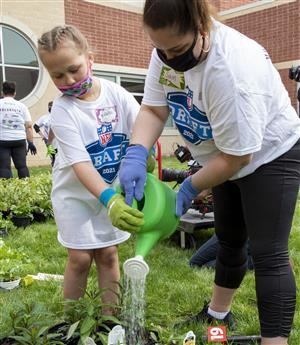 Harper students helping to build a garden